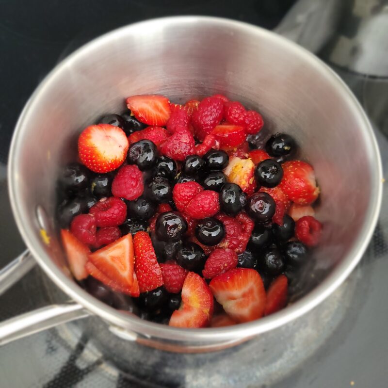 making mixed berry compote