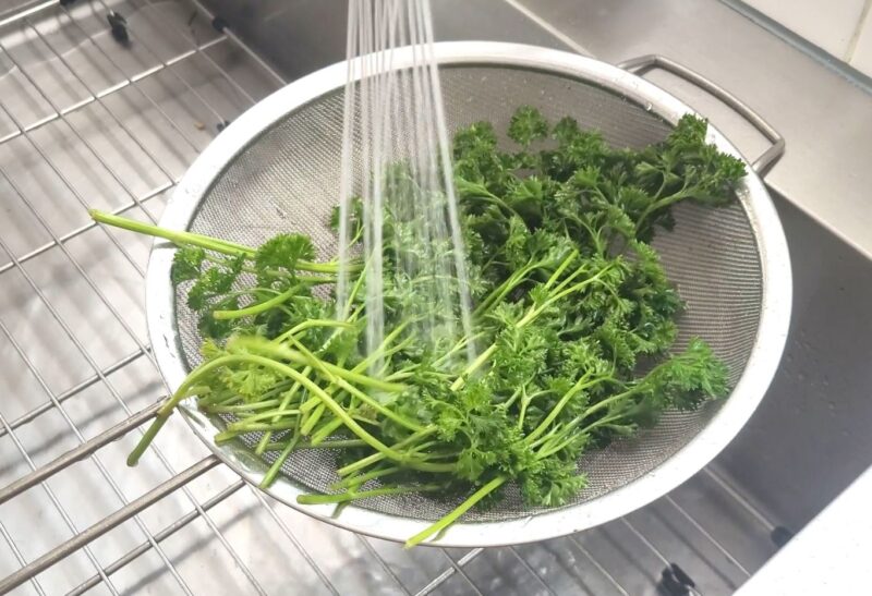 Rinse the parsley and let it drip dry