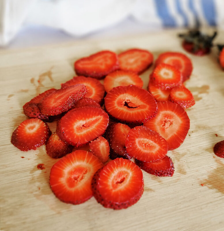 Cut the strawberries into thin, even slices