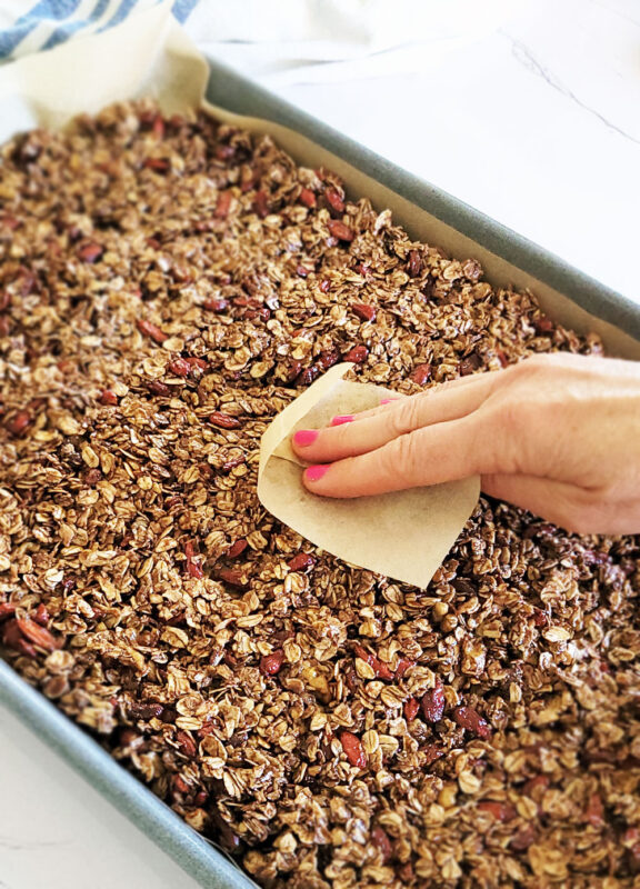 Spread the granola evenly onto the baking sheet